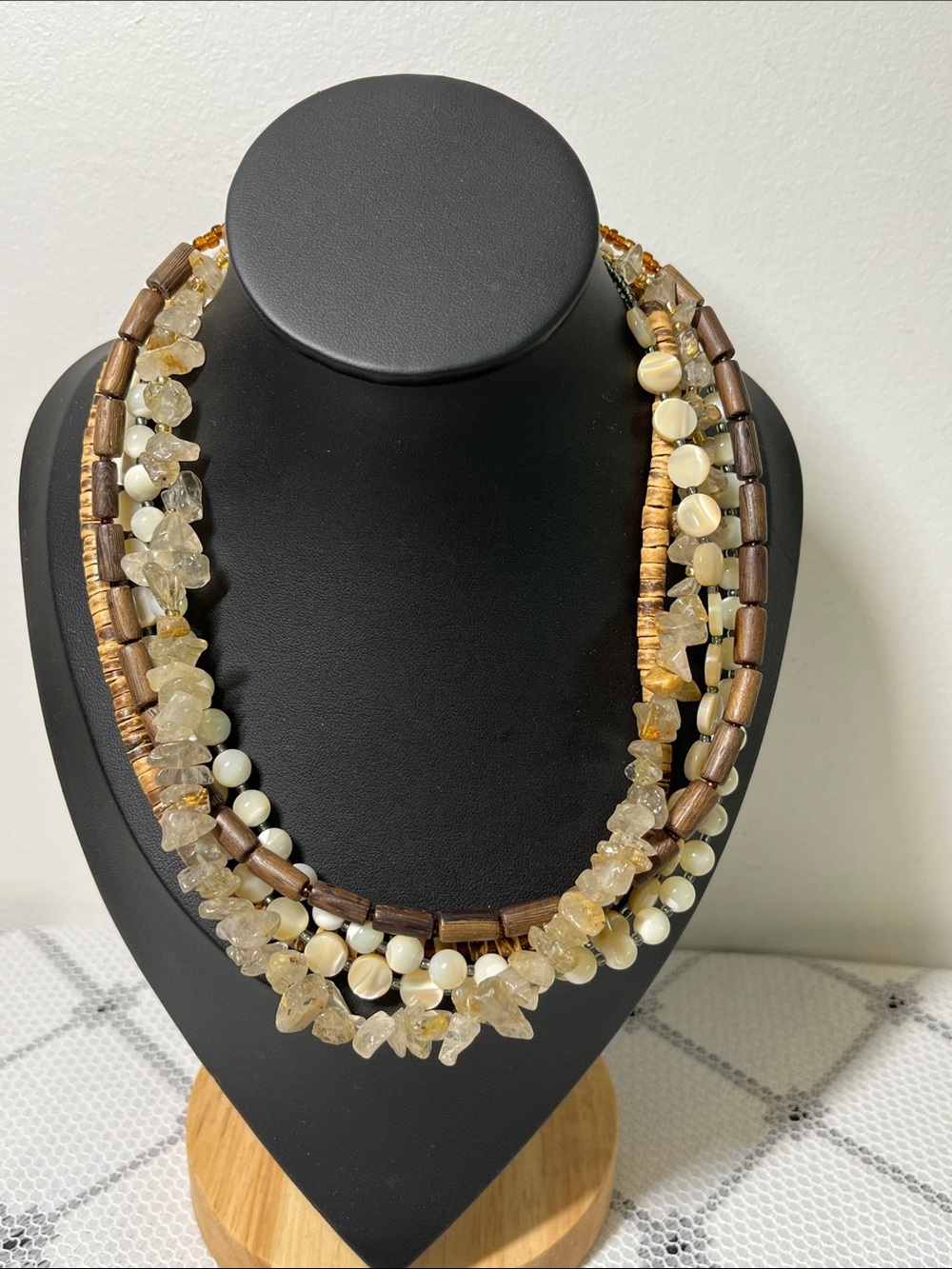 Silpada N1507 multi-strand necklace 
mother of pearl, quartz, coconut wood beads